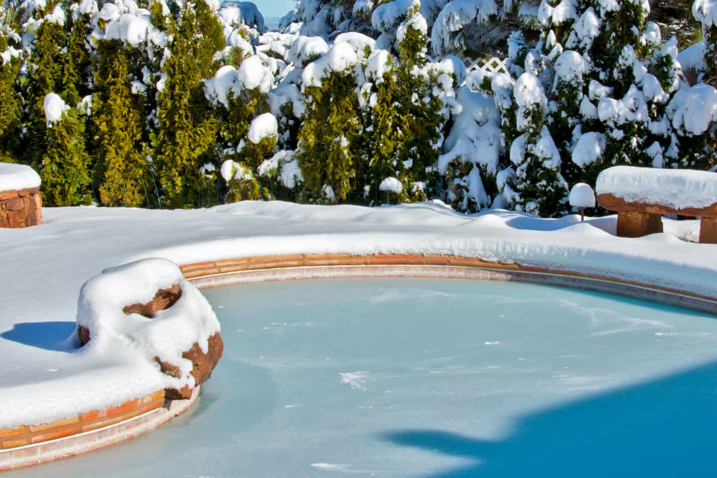 Pool covered in snow in the dead of winter